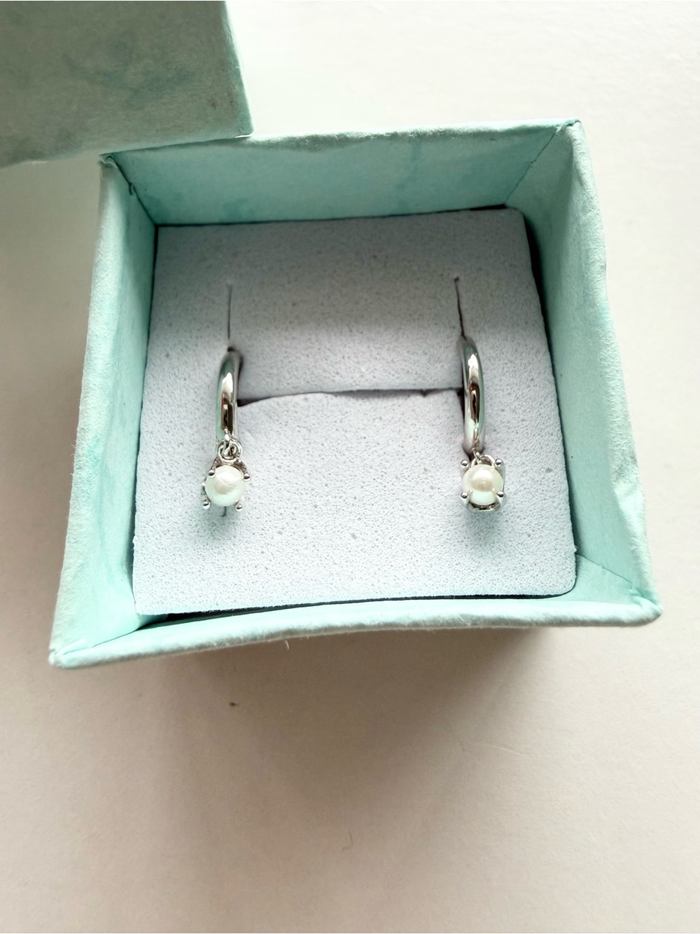 Tiny Mother of Pearl Huggie Hoop Earrings in Sterling silver